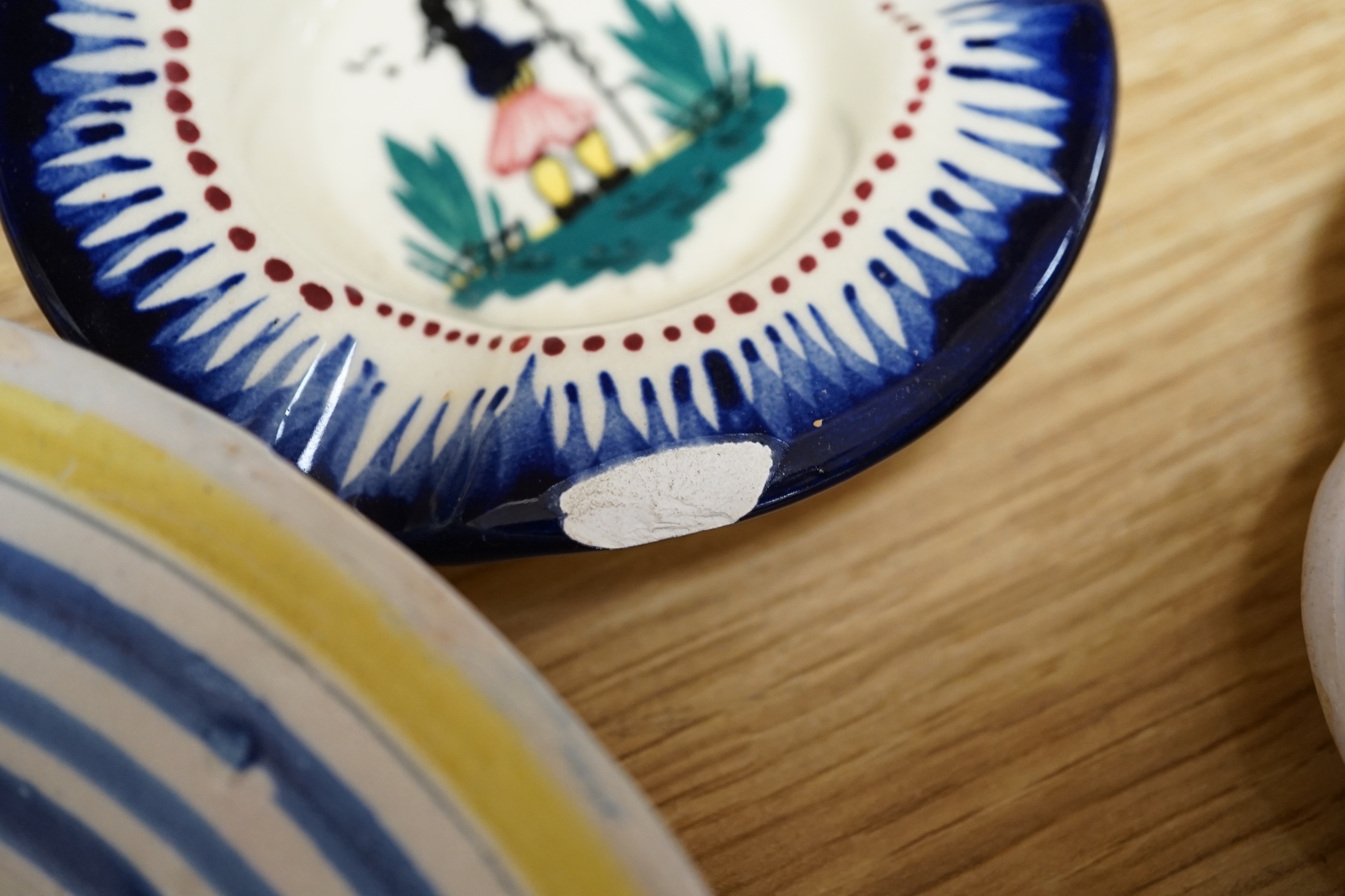 A group of Quimper pottery and a Quimper Pottery book by Angela Meadows
